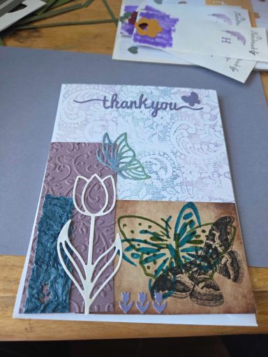 Thank you card with butterfly and flower collage.