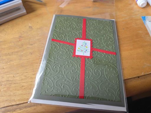 Embossed present card with tree stamp